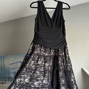 SUPER comfortable, classy black and lace dress. Gold underneath